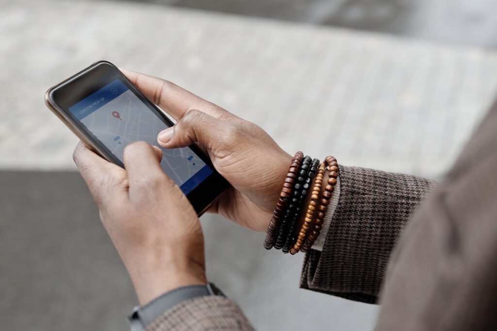 A person using a smartphone to search for a business